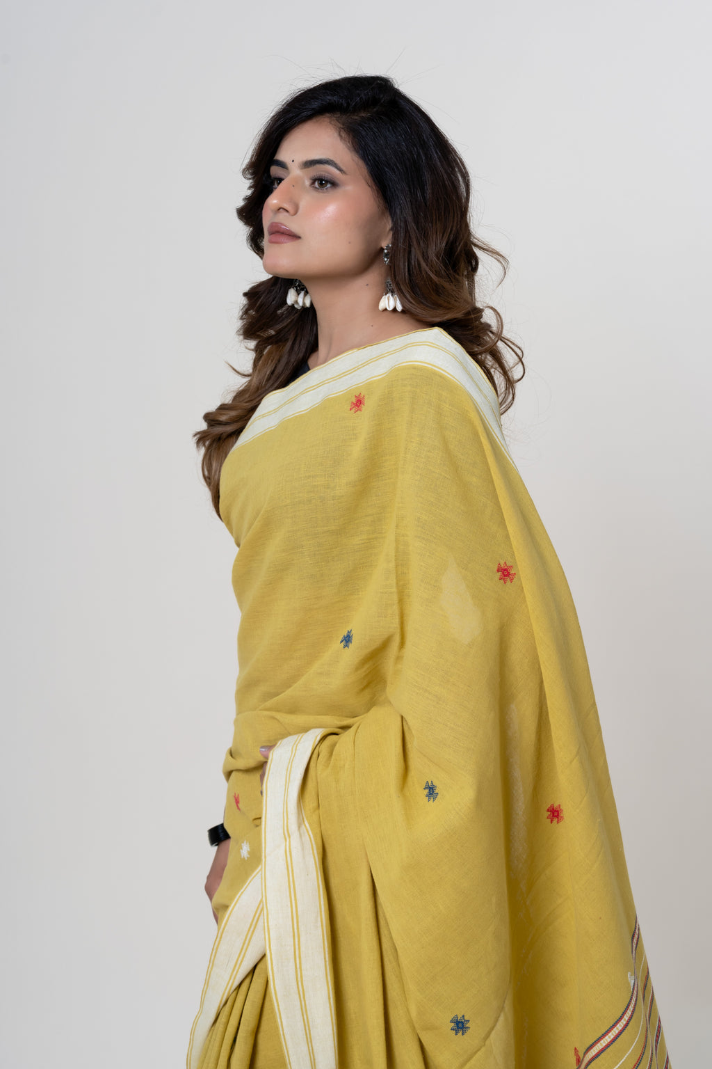 Mustard Yellow Bhujodi Handwoven Kala Cotton Saree with Multi-colored Motifs